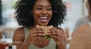 Joyful Woman Enjoying a Healthy Sandwich at Lunch