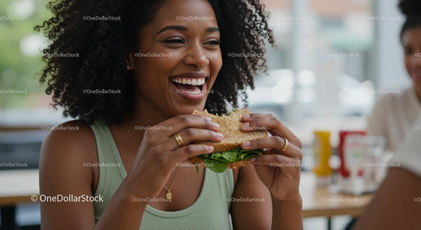 Joyful Woman Enjoying a Delicious Sandwich Indoors