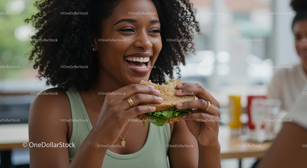 Joyful Woman Savoring a Delicious Burger Indoors
