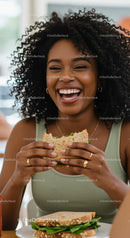 Joyful Woman Enjoying a Fresh Sandwich at Lunch