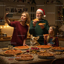 Family Enjoying Pizza Night with Cozy Holiday Vibes