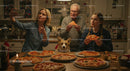 Family Enjoying Homemade Pizza with Corgi in Cozy Kitchen