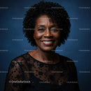 Mature Woman in Elegant Black Dress with Radiant Smile