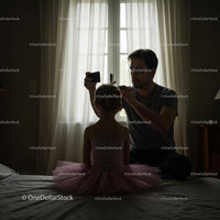Father Preparing Daughter for Ballet in Soft Morning Light