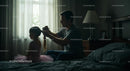 Father Styling Daughter's Hair in Cozy Bedroom Setting