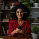 Smiling Woman in Red Blouse Using Smartphone at Home
