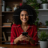 Smiling Woman in Red Blouse Using Smartphone at Home