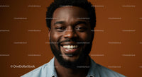 Smiling Portrait of a Man in Denim Against Brown Background