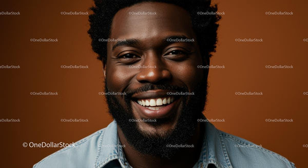 Smiling Man in Denim Shirt with Cheerful Expression