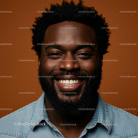 Smiling Portrait of a Man in Denim Against Brown Background