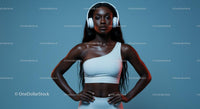 Confident Woman with Headphones in Stylish White Outfit