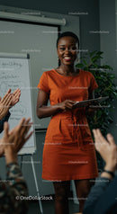 Confident Woman Giving Engaging Presentation in Orange Dress