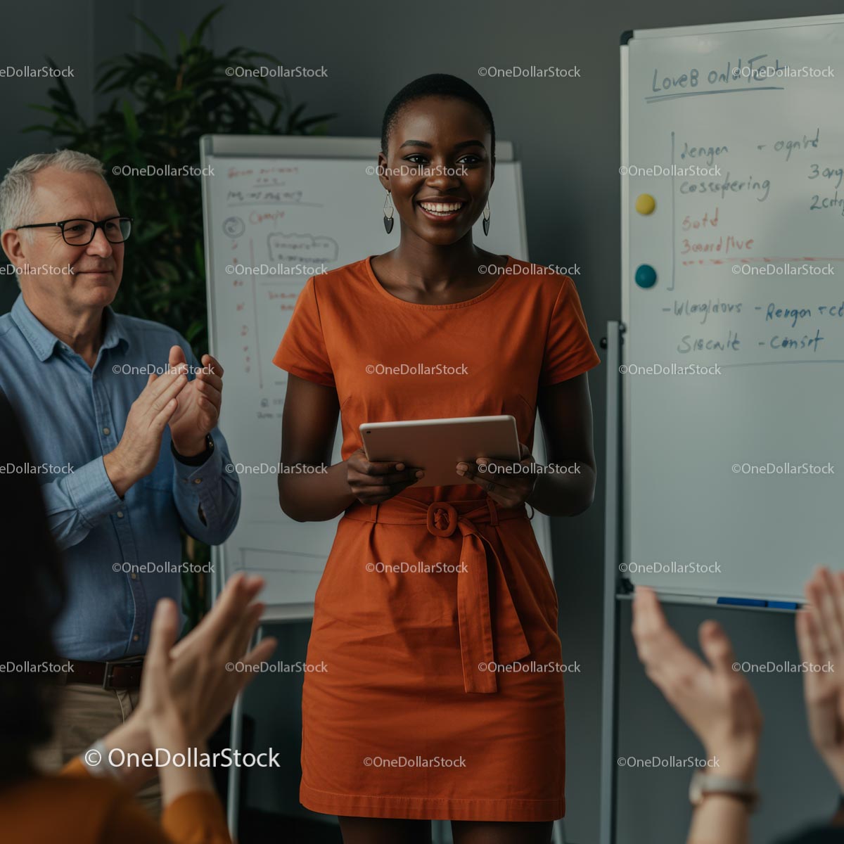 Confident Woman Giving Engaging Presentation in Orange Dress