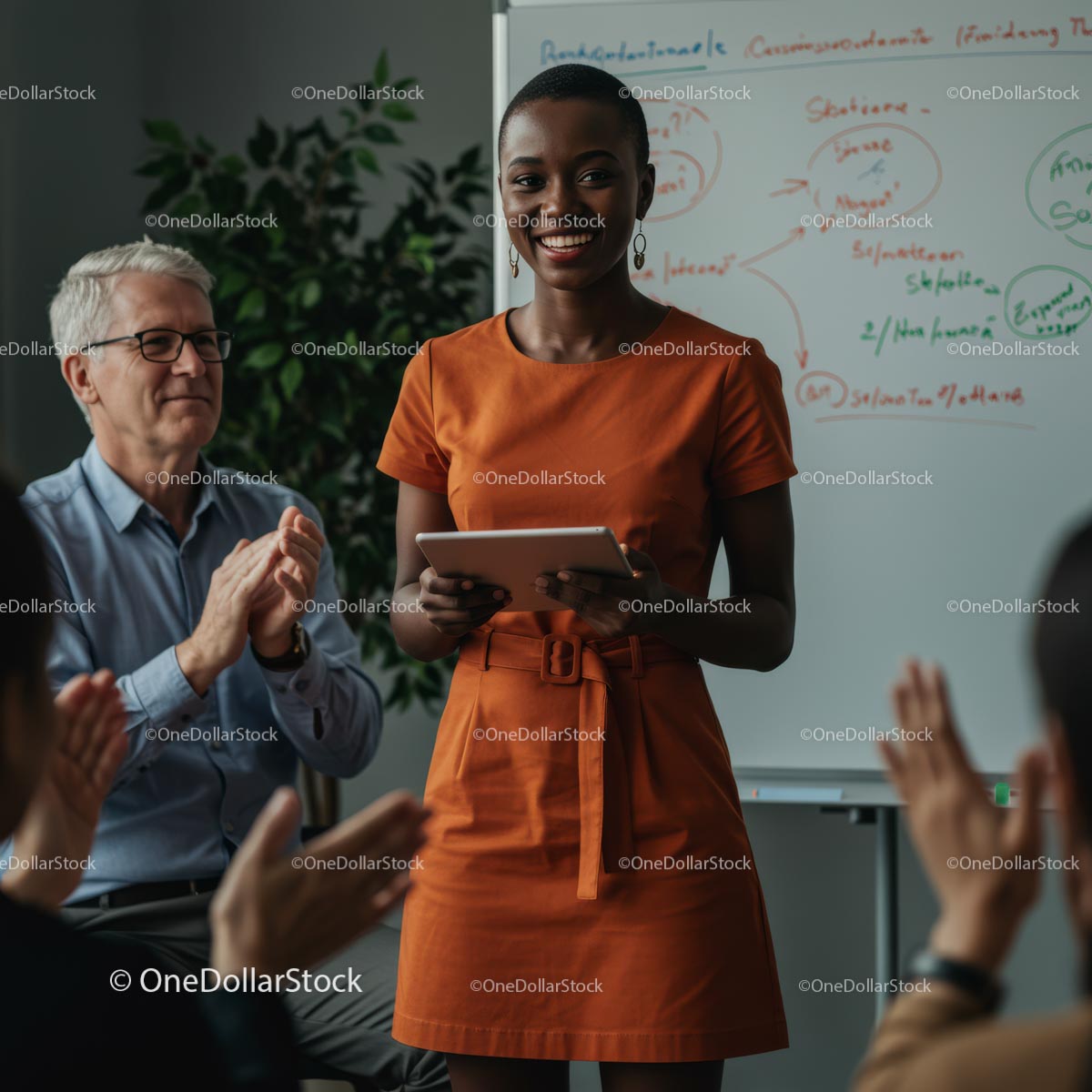 Confident Woman Giving Engaging Presentation in Orange Dress