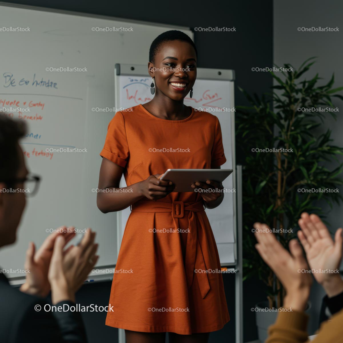 Confident Woman Giving Engaging Presentation in Orange Dress