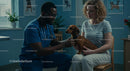 Veterinarian Examining Dachshund with Pet Owner