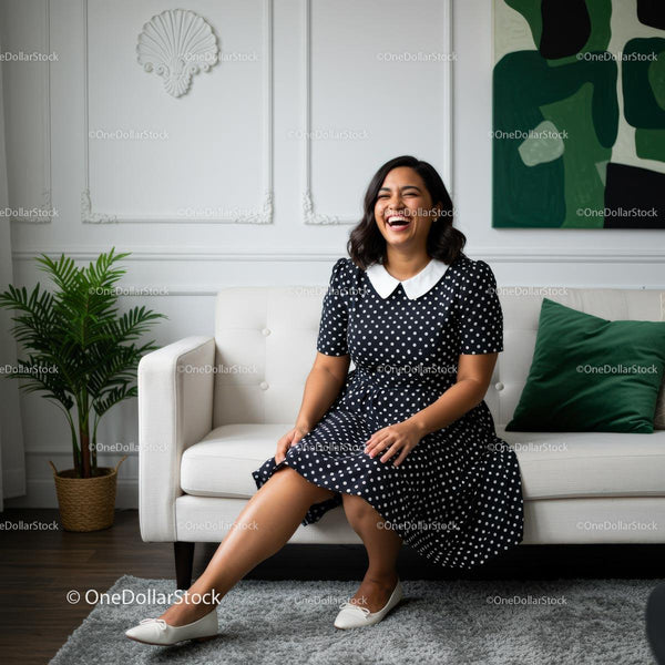 Smiling Woman in Polka Dot Dress on Modern Sofa