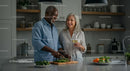 Happy Mature Couple Cooking Together in Modern Kitchen