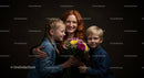 Smiling Family Portrait with Colorful Flower Bouquet