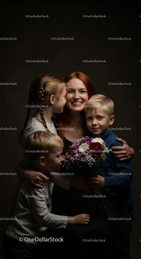 Joyful Redhead Mother Embraced by Loving Children