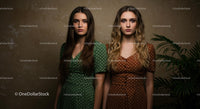 Elegant Women in Green and Brown Polka Dot Dresses