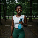 Smiling Woman Enjoying a Refreshing Walk in the Park