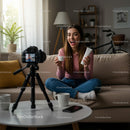 Cheerful Woman Vlogging Beauty Products in Cozy Living Room