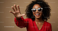 Joyful Woman in Red with Sunglasses and Curly Hair