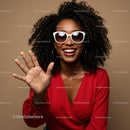 Joyful Woman in Red with Sunglasses and Curly Hair