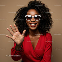 Joyful Woman in Red with Sunglasses and Curly Hair