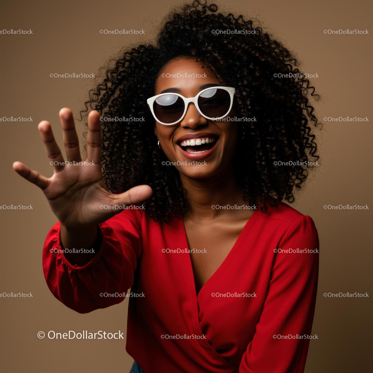 Joyful Woman in Red with Sunglasses and Curly Hair