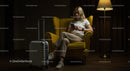 Woman Relaxing in Yellow Armchair with Suitcase and Smartphone