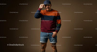 Fashionable Man in Colorful Sweater and Denim Shorts