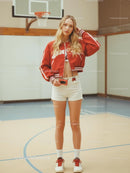Fashionable Woman in Red Jacket on Basketball Court