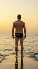 Swimmer Facing Sunset on Ocean Pier