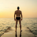 Silhouette of Swimmer at Sunset on Ocean Dock