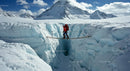 Mountaineer Crossing Rope Bridge Over Ice Crevasse