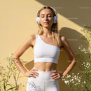 Woman Meditating with Headphones in Sunlit Garden