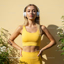 Blonde Woman in Yellow Fitness Outfit Enjoys Outdoor Workout