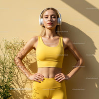 Woman in Yellow Yoga Outfit Listening to Music Outdoors