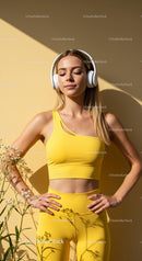 Woman in Yellow with Headphones Relaxing in Sunlight