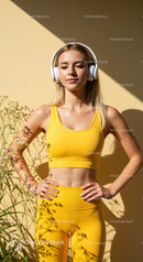 Woman in White Activewear Relaxing with Headphones