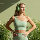 Confident Woman in Green Fitness Wear Among Daisies