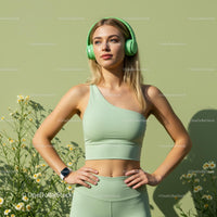 Woman in Green Activewear with Headphones in Sunshine