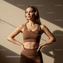 Confident Woman in Sportswear with Headphones in Sunlit Room