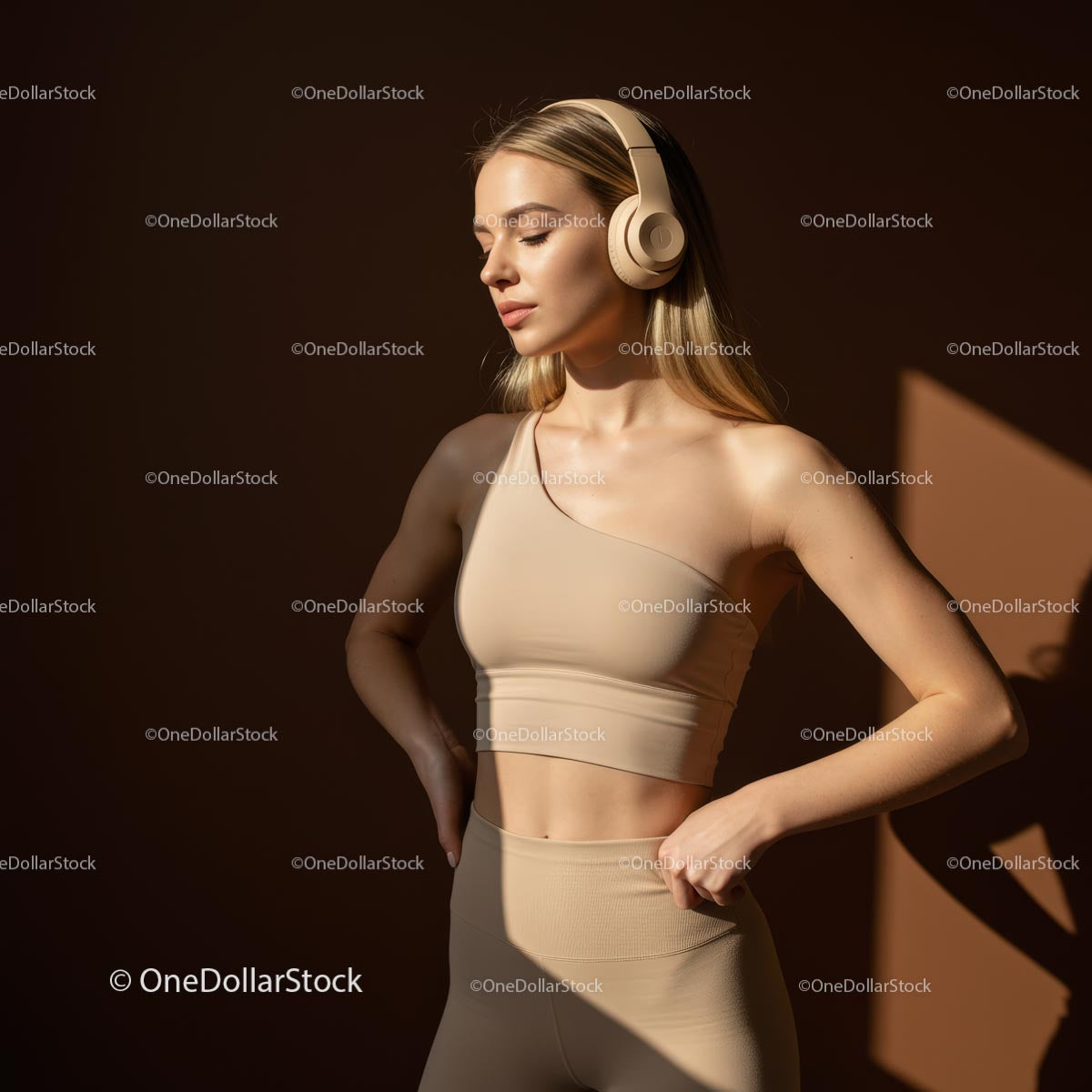 Woman in Beige Workout Attire with Headphones in Sunlight