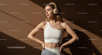 Confident Woman in Stylish Outfit and Headphones
