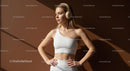 Woman in White Activewear Listening to Music with Headphones