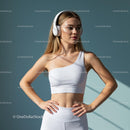 Confident Blonde Woman in White Activewear with Headphones