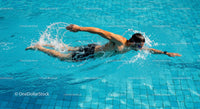 Athletic Man Performing Freestyle Stroke in Pool